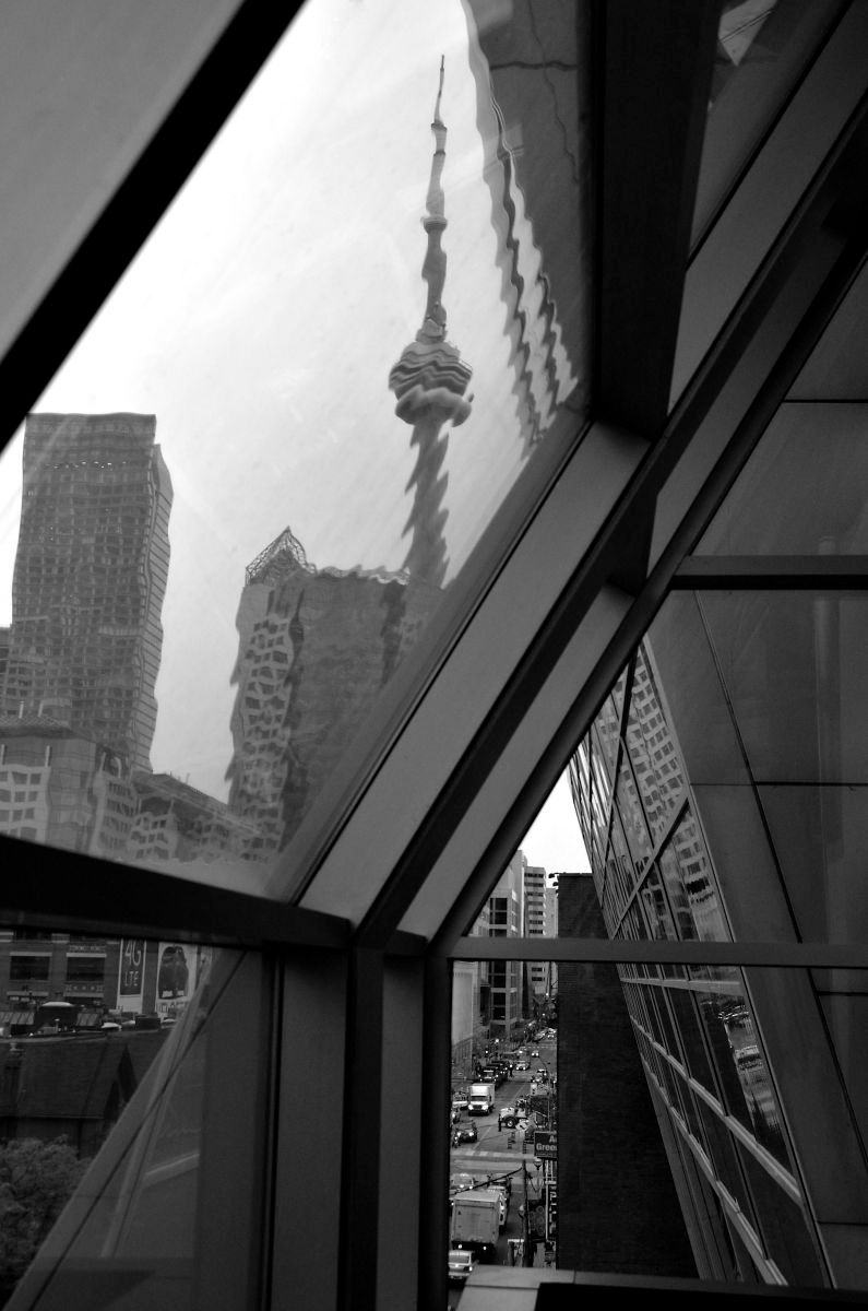 View south from the corner of John Street and Richmond Street West. John Street was named after John Graves Simcoe, the founder of York (today Toronto). During the epidemic of 1847, 863 Irish immigrants died of typhus in fever sheds built by the Toronto Board of Health at the corner of King and John streets, two blocks south of this location. From the book "Views of the CN Tower", John and Richmond St., view South