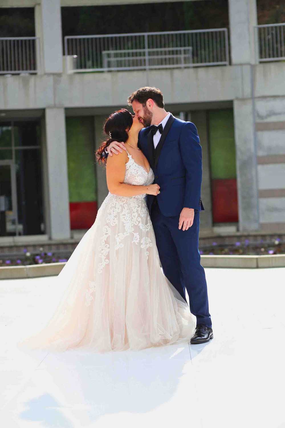 Jeff and Michelle's Wedding first look First look wedding kiss