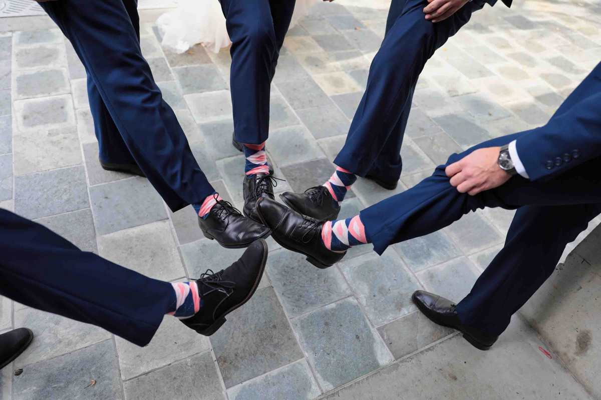 The groomsmen's socks! Groomsmen show off their style