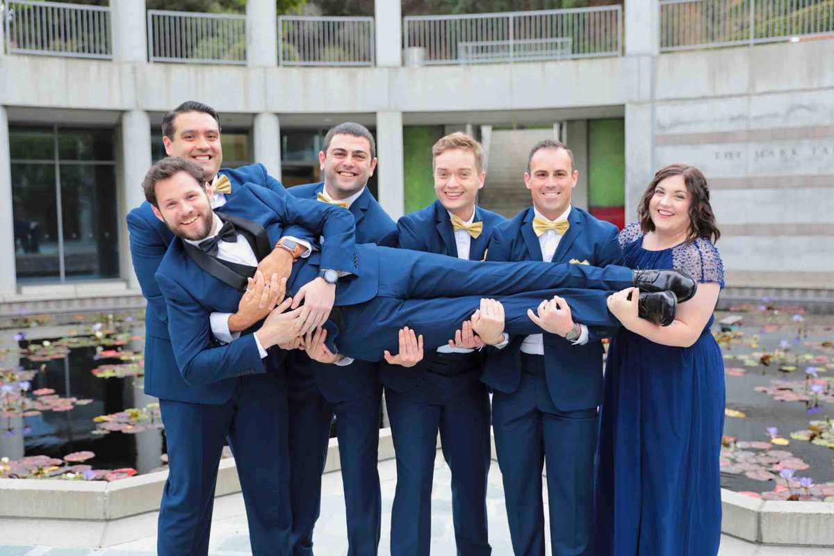 Hold that groom! Groomsmen take Jeff!