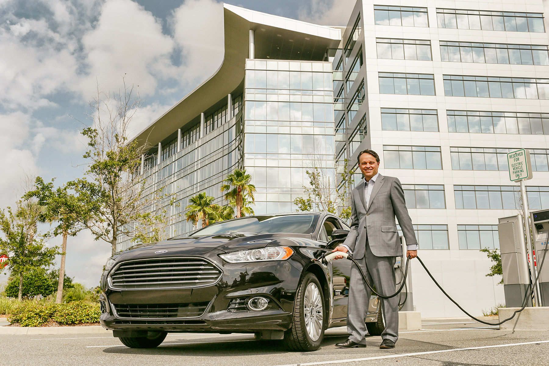 Brent Dewar NASCAR COOWith his electric car for theWall Street Journal