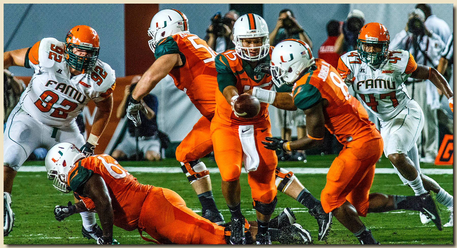 Miami Hurricanes vs Florida A&M Rattlers at Sun Life Stadium  09-06-2014 Brad Kaaya (15) Handing Off To Duke Johnson (8) 1