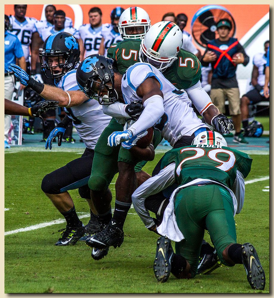 Miami Hurricanes vs North Carolina Tar Heels at Sun Life Stadium  11-01-2014 Jermaine Grace (5) and Corn Elder (29) Tacklers
