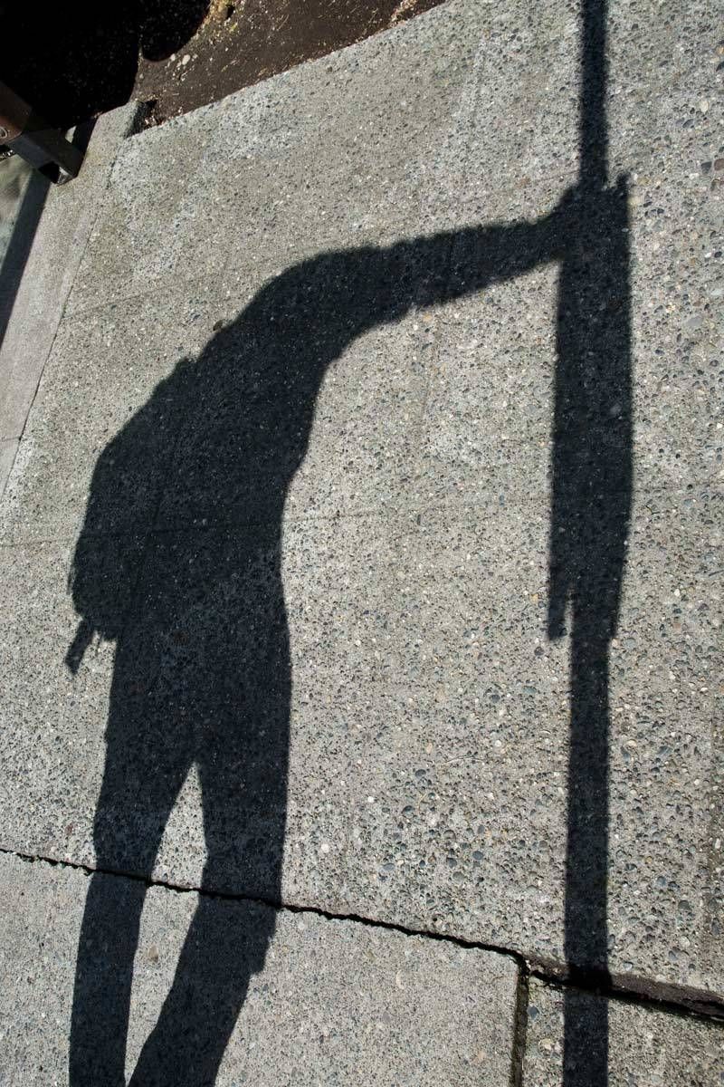 shadow of guy waiting on bus