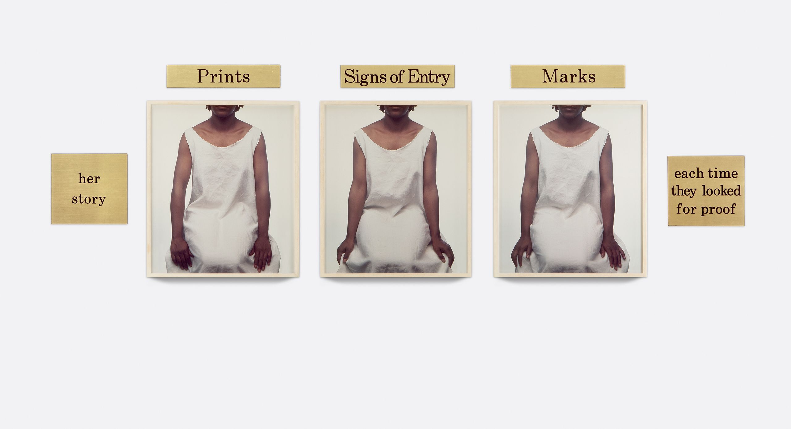 3 dye diffusion color Polaroid prints, 5 engraved plastic plaques - Overall: 31 x 94 1/4 x 1 3/8 in (78.7 x 239.4 x 3.5 cm), "The plain white background, the bright, even lighting, and the frontal pose employed in each bring to mind identification photos or mug shots. But, unexpectedly, all three are cropped just above the woman's chin and below her knees, giving us few clues about her situation. Clad only in a white sleeveless shift, so plain it reveals nothing personal, she holds her arms at her sides, her hands alone betraying a slight tension as they rest on or grasp the edges of the table. Considered by themselves these images ages convey the apprehension and vulnerability many women feel in a doctor's sterile examination room." -Bonita McLaughlin Three Seated Figures, 1989