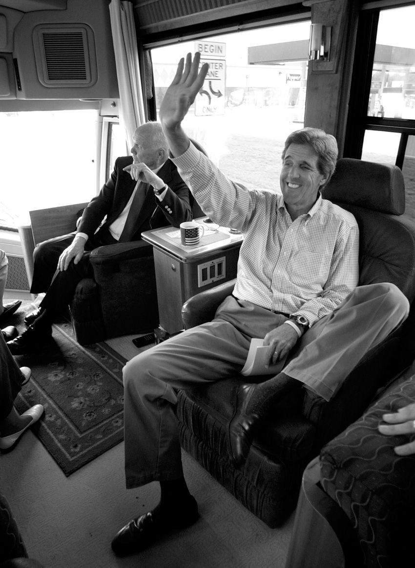 Democratic presidential nominee, Sen. John Kerry, D-Mass., waves to supporters from his campaign bus while traveling with former Sen. John Glenn, D-Ohio,  in Newark, Ohio on Friday, Sept. 3, 2004. John Kerry Presidential Campaign 2004