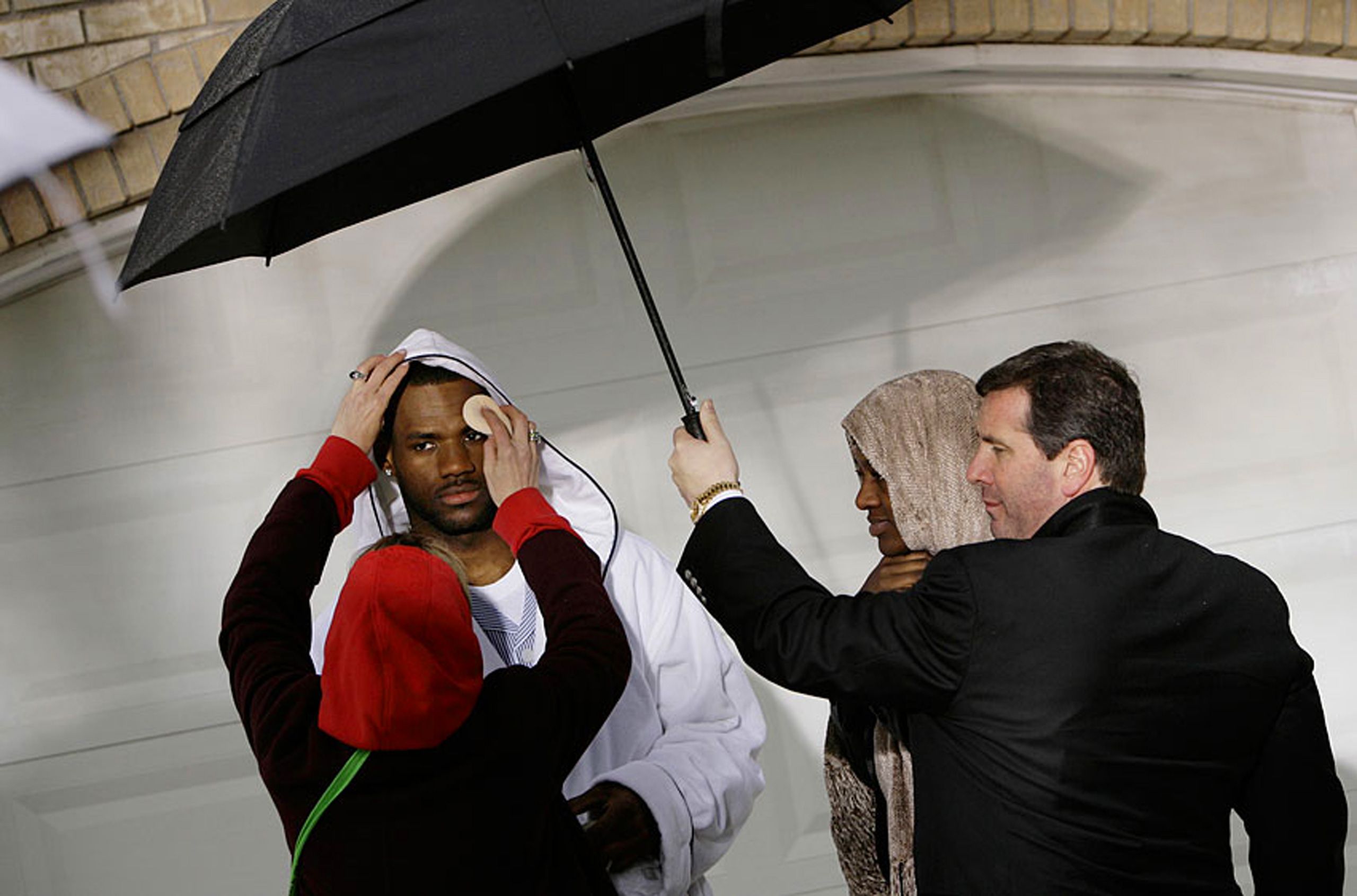 LeBron James has gets a touch-up while filming a lawn mower commercial in the rain in Las Vegas in 2007. LeBron James