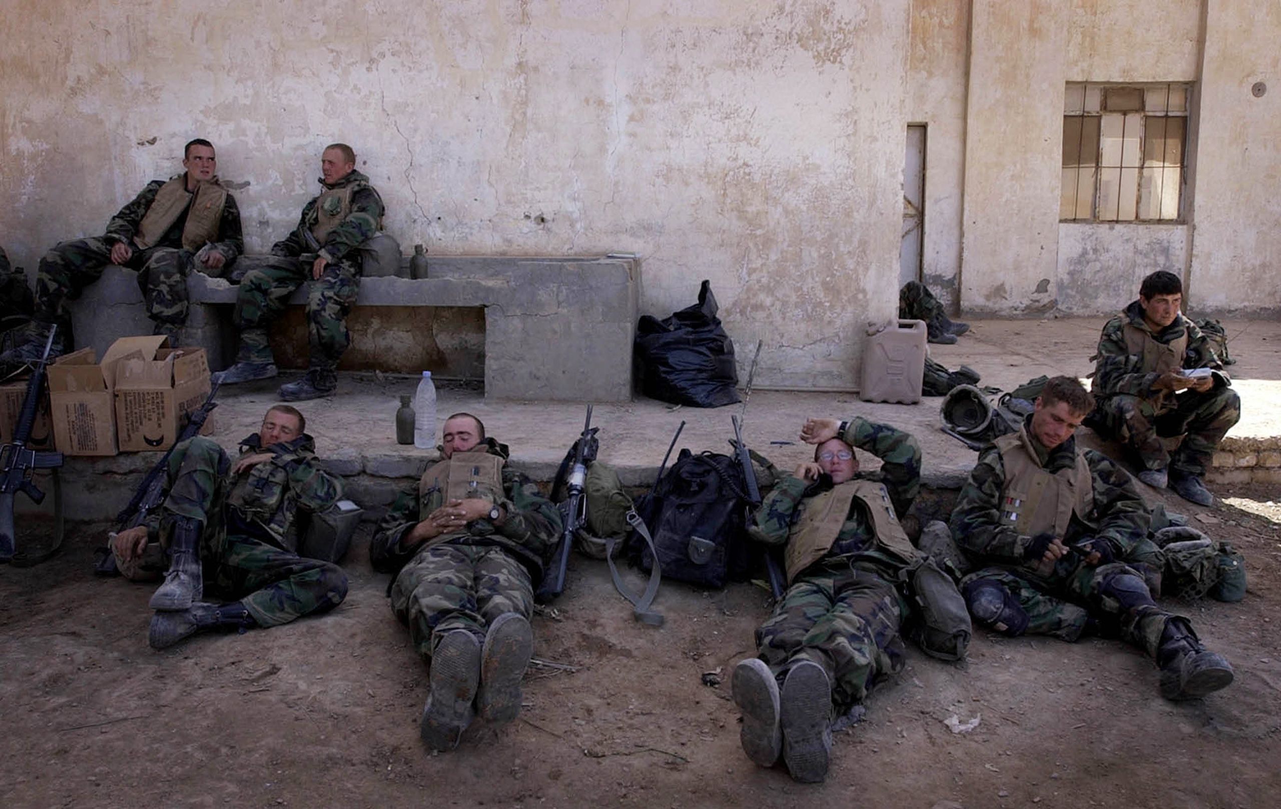 Marines with India Co., 3rd Batt., 7th Marines, 1st Marine Division, rest at a school in An Numaniyah, Iraq on Thursday, April 3, 2003. Invasion of Iraq