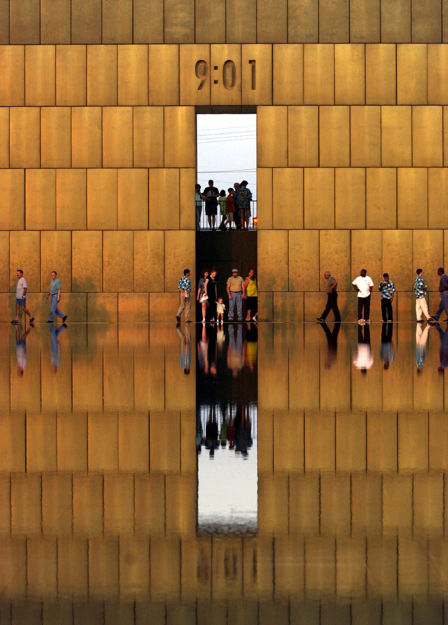 Visitors walk past the east gate of time at the Oklahoma City National Memorial in Oklahoma City on Saturday, June 9, 2001. Timothy McVeigh, who was found guilt and sentenced to death for the bombing of the Alfred P. Murrah building in 1995, will be executed on Monday, June 11, 2001. Timothy McVeigh Execution Oklahoma City