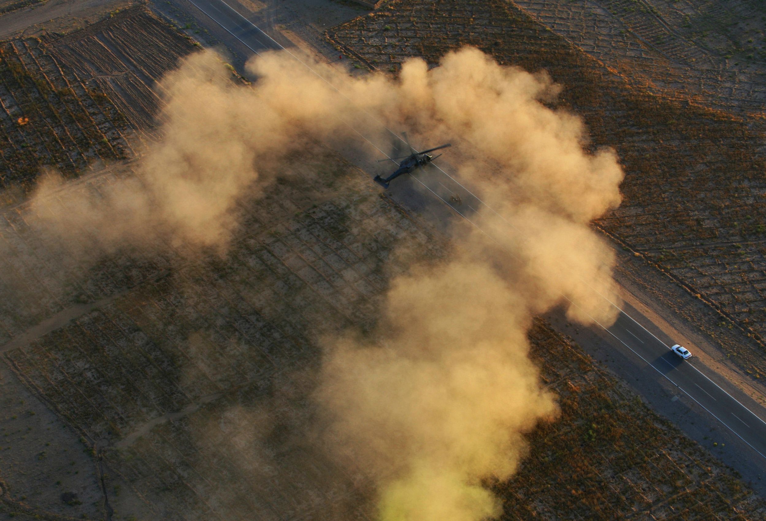 An Air Force Pararescue HH-60 Pave Hawk lands on a road in Helmand province, Afghanistan to pickup the wounded on June 9, 2012.  Air Force Pararescue