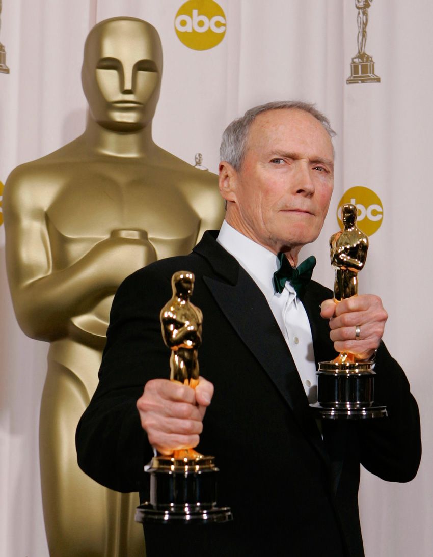 Director Clint Eastwood poses with the Oscars he won for best director and best picture for his work on "Million Dollar Baby" at the 77th Academy Awards Sunday, Feb. 27, 2005, in Los Angeles.  Clint Eastwood Oscars