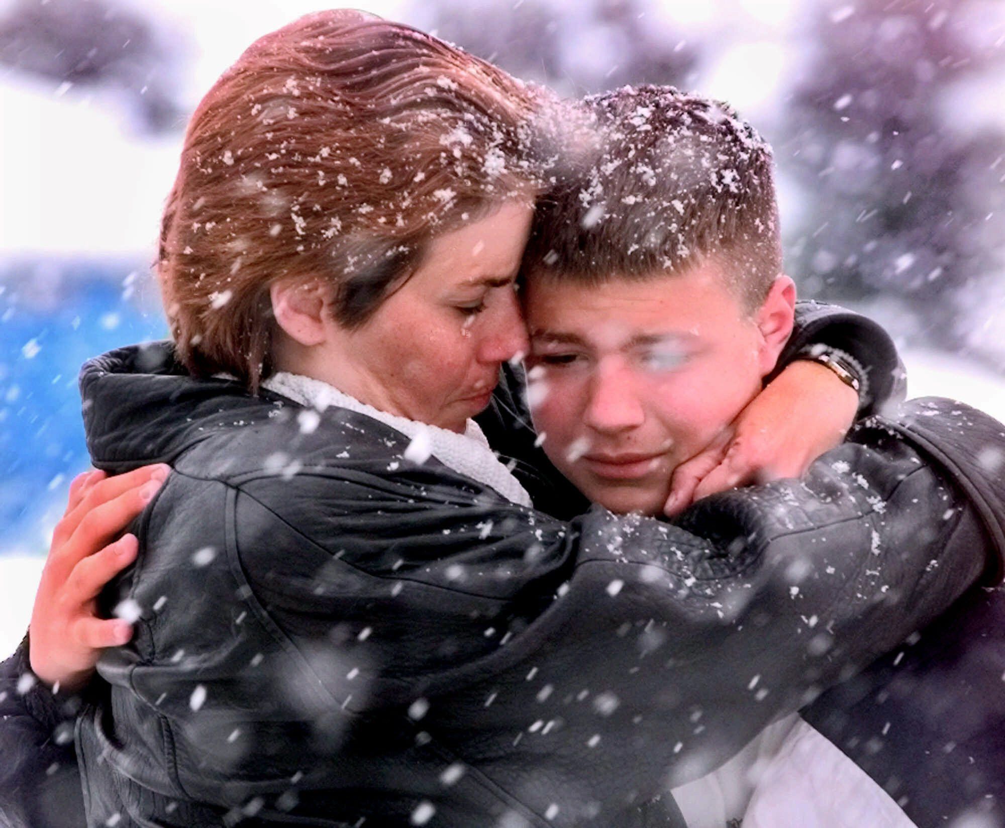 Sharon McManus hugs her son Ed during a visit to a make shift memorial in a park near Columbine High School in Littleton, Colo., Thursday, April 22, 1999. Mourners have visited the area in a steady stream since the shooting spree at the school on Tuesday.  Columbine Shootings