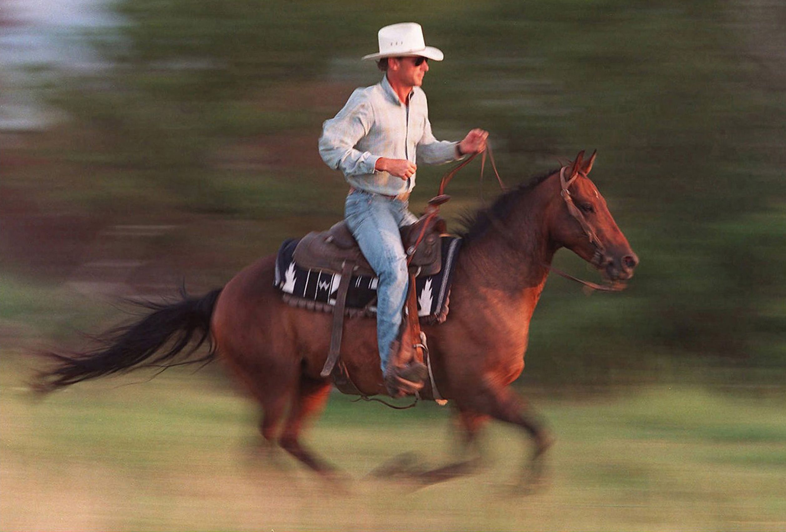 Robert Vestring rides his horse "Pepe" during a cattle roundup near his family's ranch headquarters in Cassoday, Kan. in 1997.  Kansas Cowboys