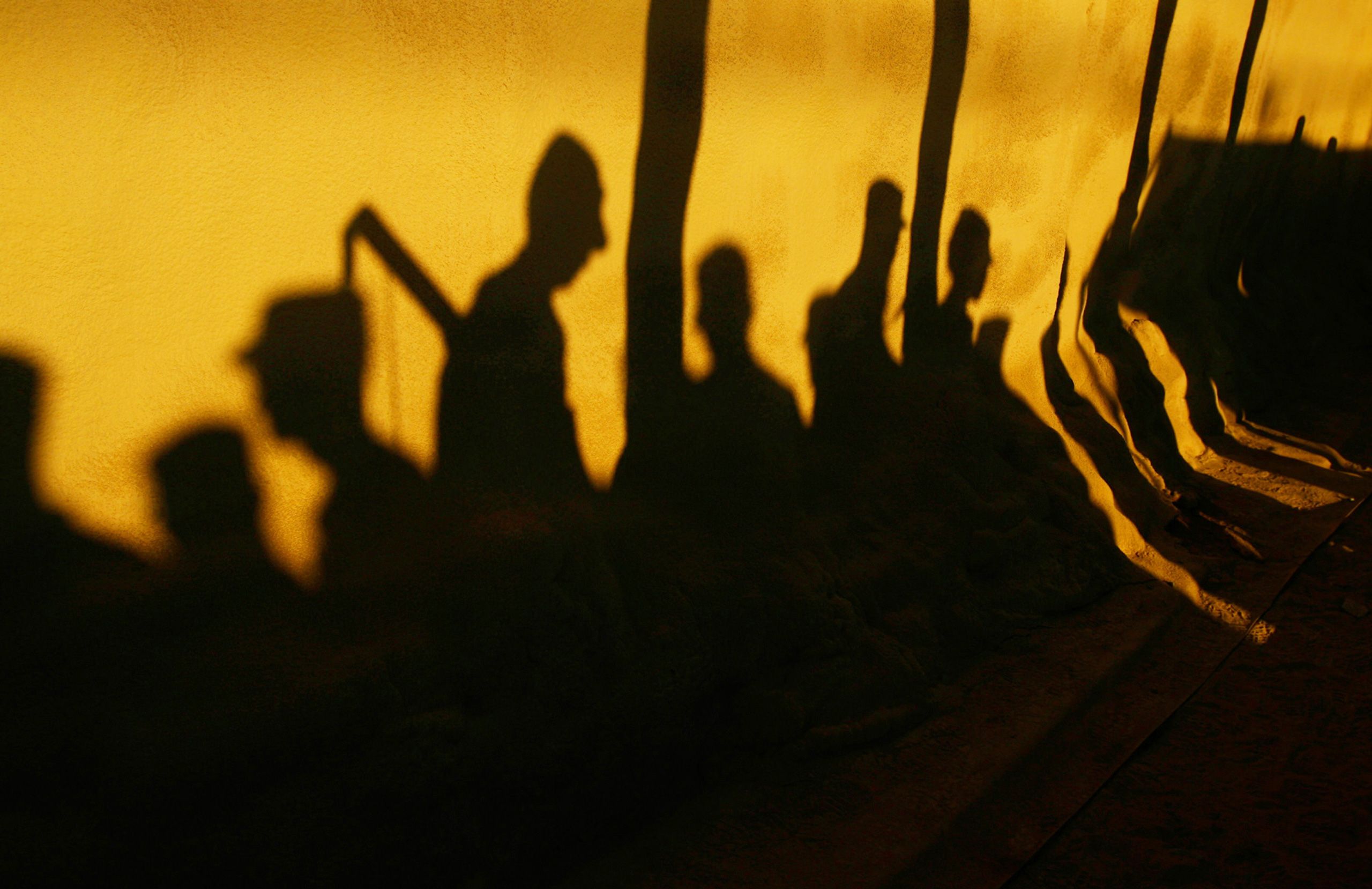 Shadows of soldiers with the 10th Mountain Division's 3rd Brigade Combat Team fall on their tents as they line up for formation at Kandahar Air Field, Afghanistan on February 29, 2012. The soldiers were on their way to Fort Drum, NY after a year deployment.  Kandahar Airfield Afghanistan