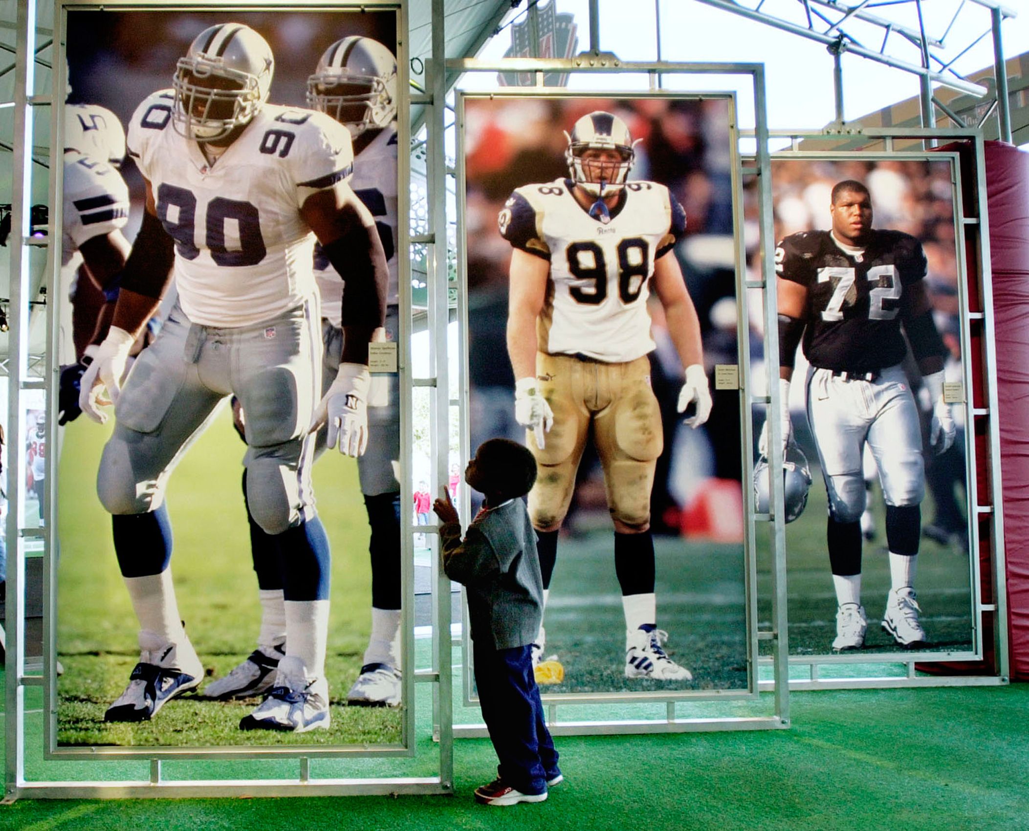 Special Le Jackson looks at giant displays of NFL players as he tours the NFL Experience outside Raymond James Stadium in Tampa, Fla. Saturday, Jan. 27, 2001, a day before the Super Bowl  between the New York Giants and the Baltimore Ravens.  Super Bowl 2001