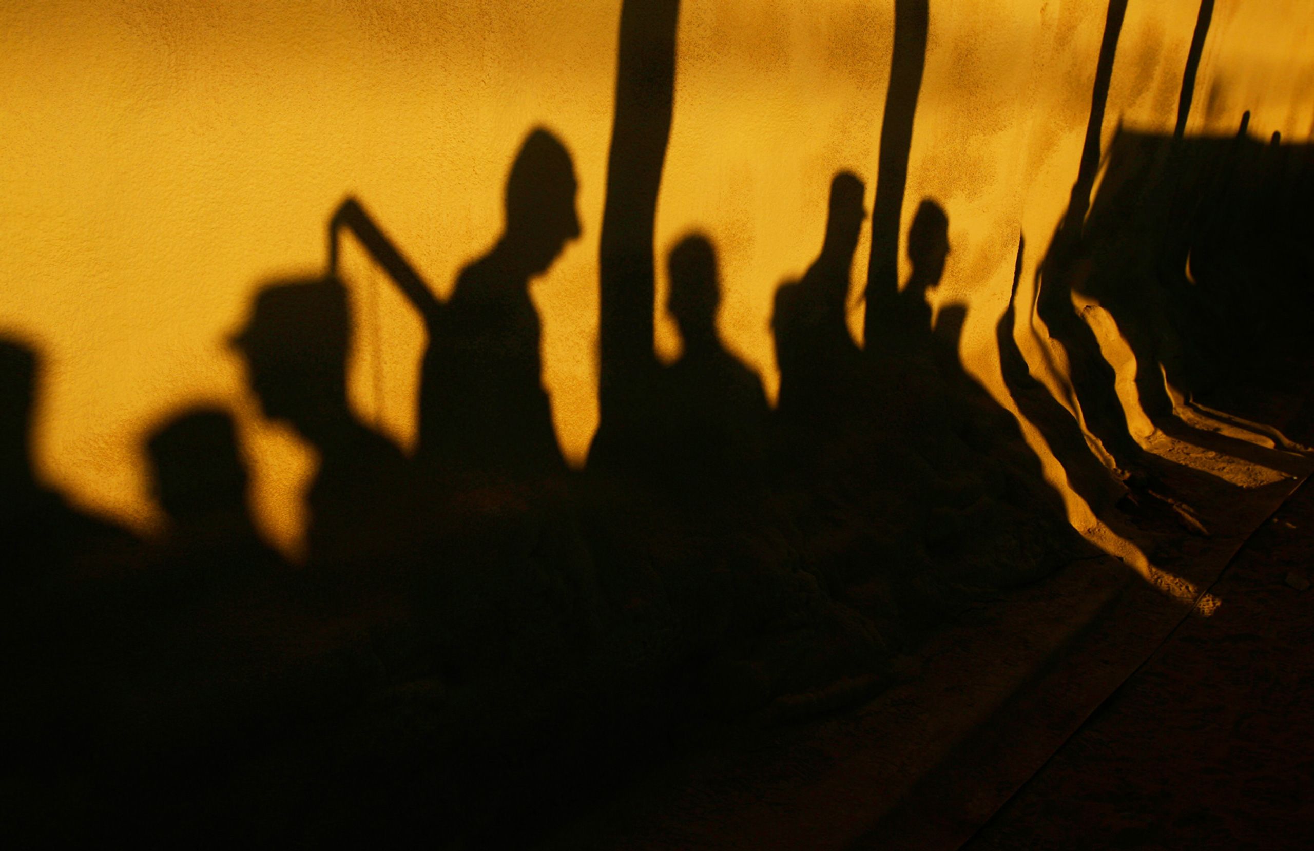 Shadows of soldiers with the 10th Mountain Division's 3rd Brigade Combat Team fall on their tents as they line up for formation at Kandahar Air Field, Afghanistan on February 29, 2012. The soldiers were on their way to Fort Drum, NY after a year deployment.  10th Mountain Division