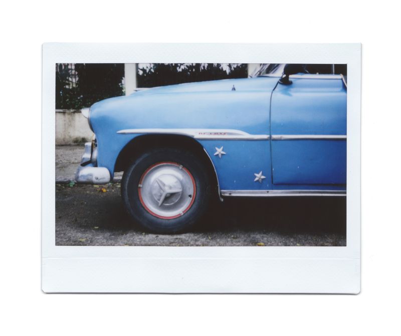 A blue vintage car in Cuba on Instax instant film