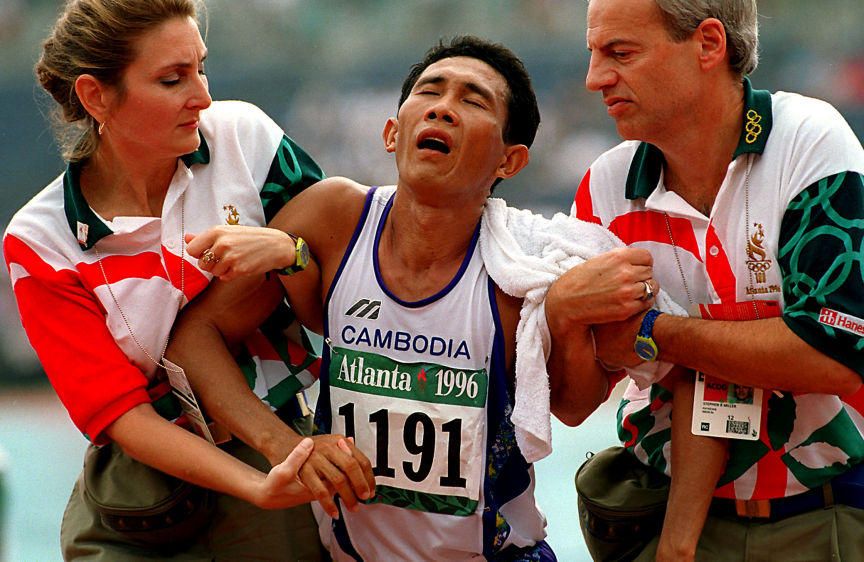 Atlanta's heat and humindity gets the best of this Cambodian marathoner during the 1996 Olympic Summer Games in Atlanta. OLYMPIC MARATHON