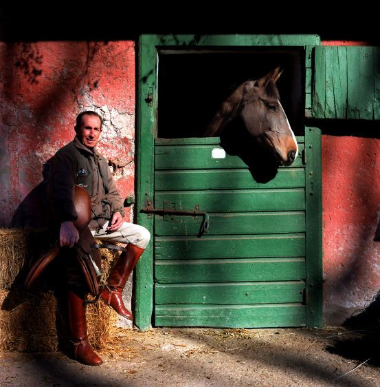 Italian Raimondo D'Inzeo, eight-time Olympian and gold medal winner at the 1960 Rome Games, is considered the best show jumper ever to compete and as a result became a national hero. D'Inzeo was photographed at the stables where he still teaches in the heart of Rome, Italy. ITALIAN RIDER TRAIMONDO D'INZEO