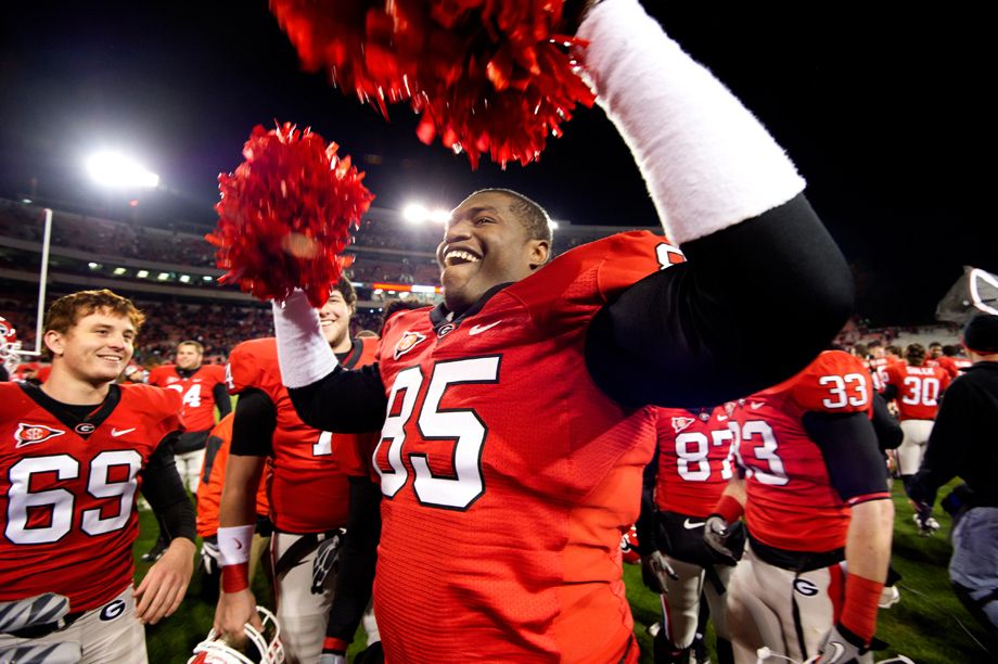 University of Georgia player Derrick Lott celebrates his team's win over state rival, Georgia Tech, like a cheerleader.  Photographed for the Associated Press. A CHEER FOR GEORGIA