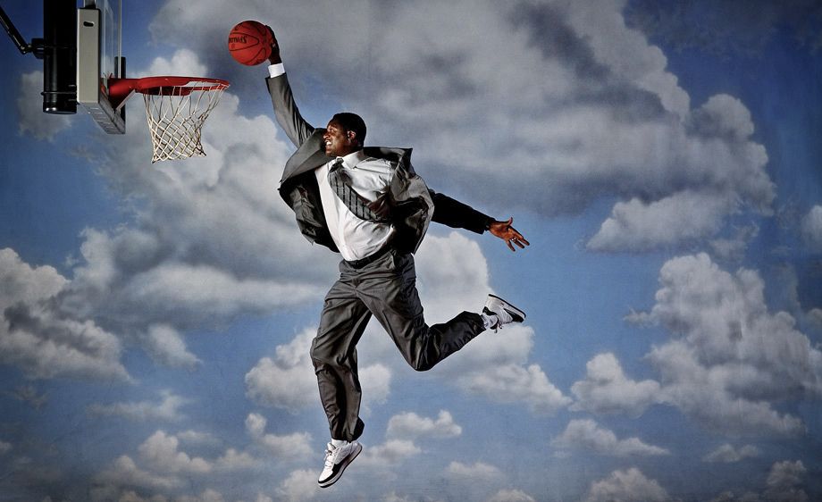 One of the most spectactular players in NBA history, Dominique Wilkins, also known as the "Human Highlight Film" dunks in his business suit for a profile picture on his induction into the Basketball Hall of Fame. DOMINIQUE WILKINS