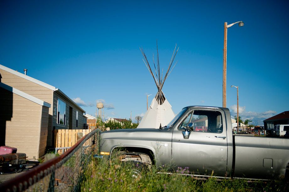 A teepee in the front yard of a home on the Blackfeet Indian Reservation near Browning, MT. Photographed for the New York Times. TEEPEE RISING