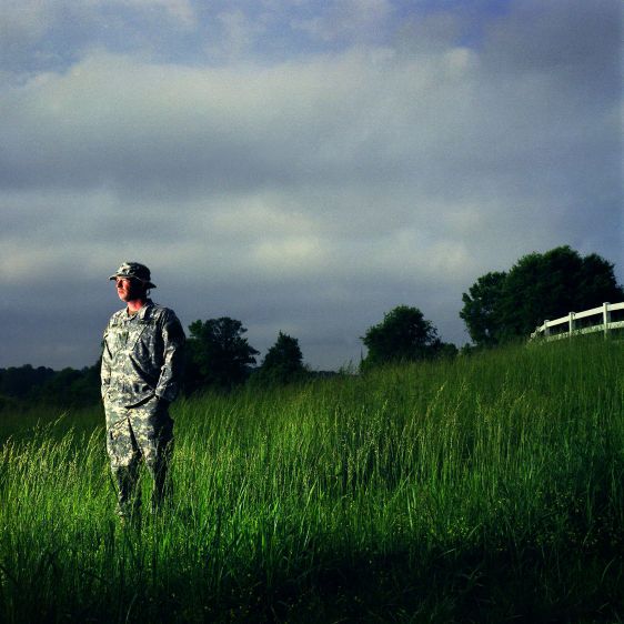 Spc. Shane Parham, 30, a member of Georgia National Guard's 48th Brigade that served in Iraq, lost eight fellow soldiers in the span of two weeks. Parham, who says he feels guilty that he came back alive, stands alone in the field outside his country home. Parham said in war your fellow soldiers become your surrogate family, which helps explain why the experience haunts him today. IRAQ SURVIVOR