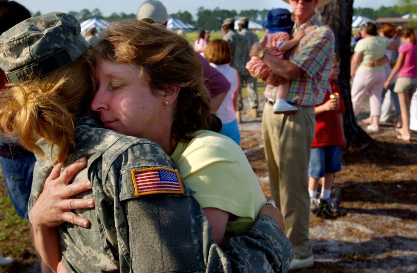 Brean Hancock, 18, the youngest member of the Dublin unit of the Georgia Army National Guard's 48th Combat Team, is hugged by her mother in a final "goodbye" prior to leaving for duty in Iraq. Hancock made a point not to cry, saying she needed to be strong for her mom. OFF TO WAR