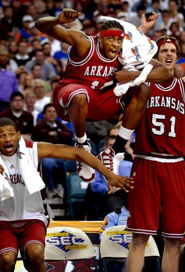 Arkansas Michael Washington and his teammates celebrate a late-game dunk in their defeat of Mississippi State in the SEC basketball tournament. SEC BASKETBALL