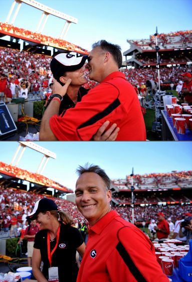 ...while Georgia head football coach Mark Richt gets a victory kiss from the team's water girl, also known as his wife, Katharyn, after defeating Spurrier's Gamecocks. MARK RICHT