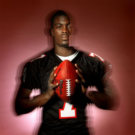 NFL Superstar Michael Vick as a rookie for the Atlanta Falcons. In 2007, Vick was convicted of dogfighting, serving a 23-month prison sentence. MICHAEL VICK