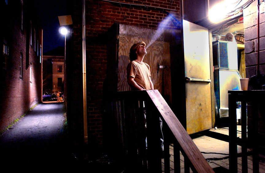 Tony Foresta, steals a quick smoke, before heading back to work as a server at a pub in downtown Decatur, GA. BLOWING SMOKE