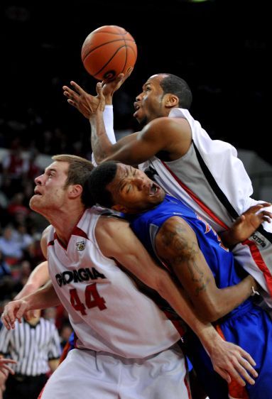 The Universisty of Georgia's Sundiata Gaines climbs over players on his way to the basket. BULLDOG BASKETBALL