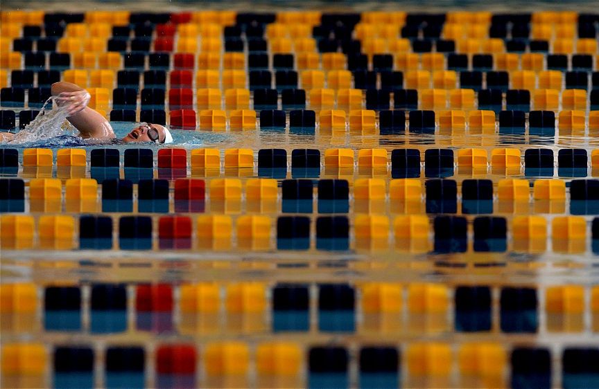 An early morning swimming workout at Georgia Tech's aquatic center, which was the swimming venue during the 1996 Summer Olympic Games. EARLY MORNING SWIM