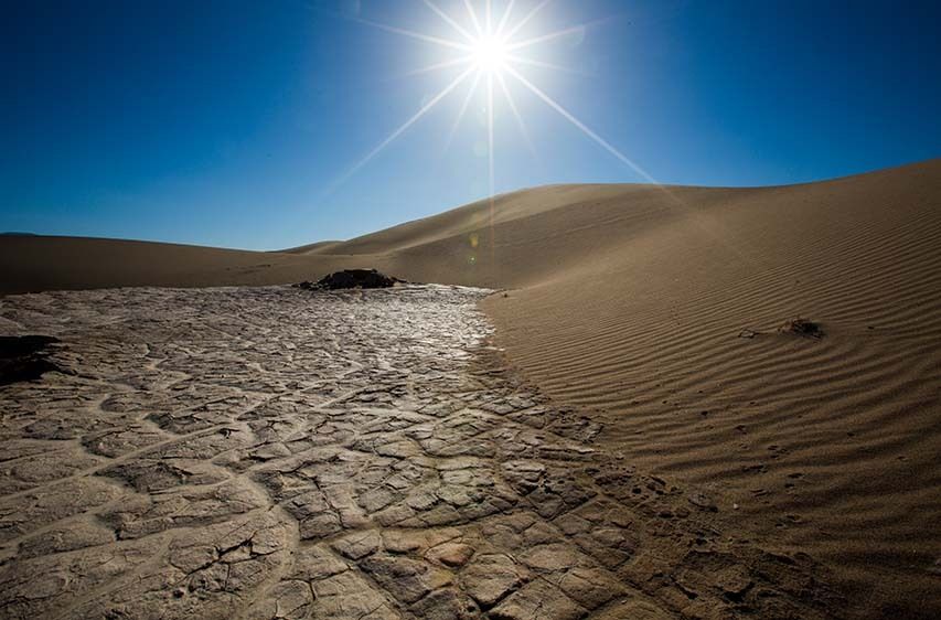 Death Valley sand dunes with sun flare