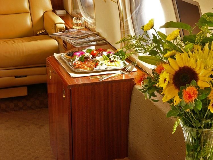 Gulfstream jet interior detail with food and flowers