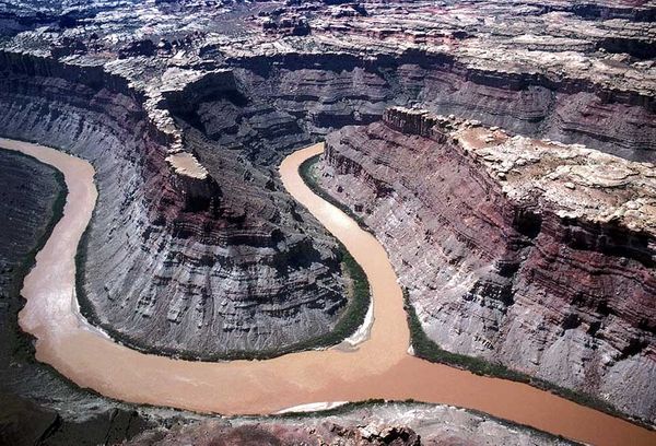 Canyonlands National Park, UtahThe confluence of the Green and Colorado Rivers is the heart of the Colorado Plateau. The Green River drops in from the upper center of the photograph and joins the Colorado River, coming in from the lower right of the photograph. The Colorado River continues on towards Cataract Canyon, just beyond the upper left of the image. This is a magical place. The Confluence