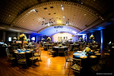 Indian wedding reception with custom backdrop and event lighting Indian wedding reception with custom backdrop and event lighting