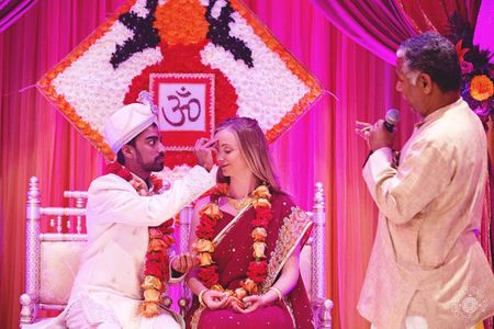 Indian wedding ceremony under mandap with custom backdrop Indian wedding ceremony under mandap