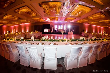 Indian wedding reception with custom backdrop and vintage furniture Indian wedding reception with custom backdrop and vintage furniture