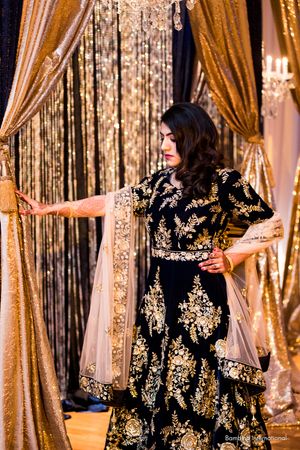 Indian wedding reception with custom backdrop and event lighting Indian wedding reception with custom backdrop and event lighting