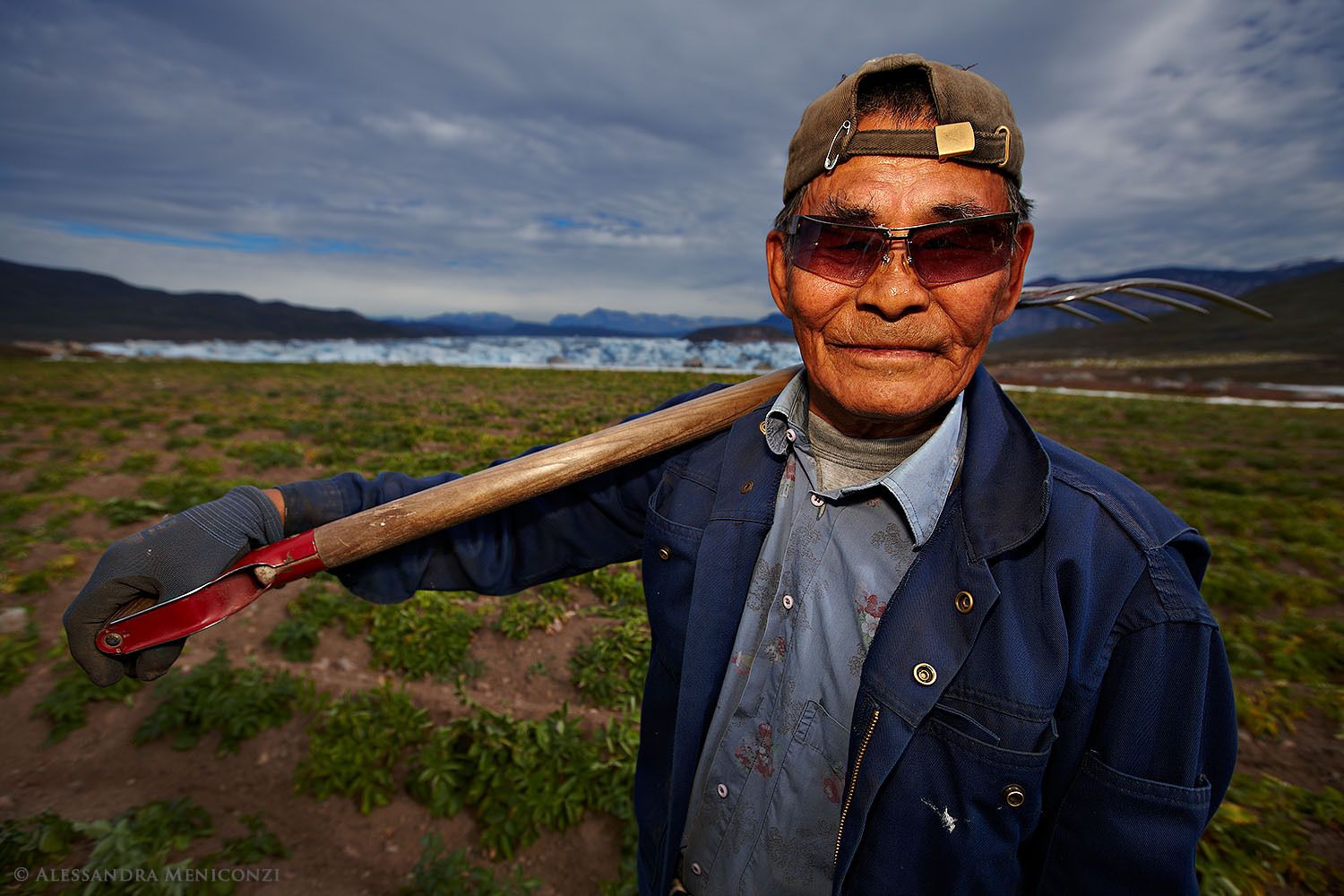 Jorsen Adelsen, a 61-year-old Inuit worker at the Equaluit Ilua farm, pauses momentarily while helping to harvest the potato crop  in Sermilik Fjord, South Greenland.