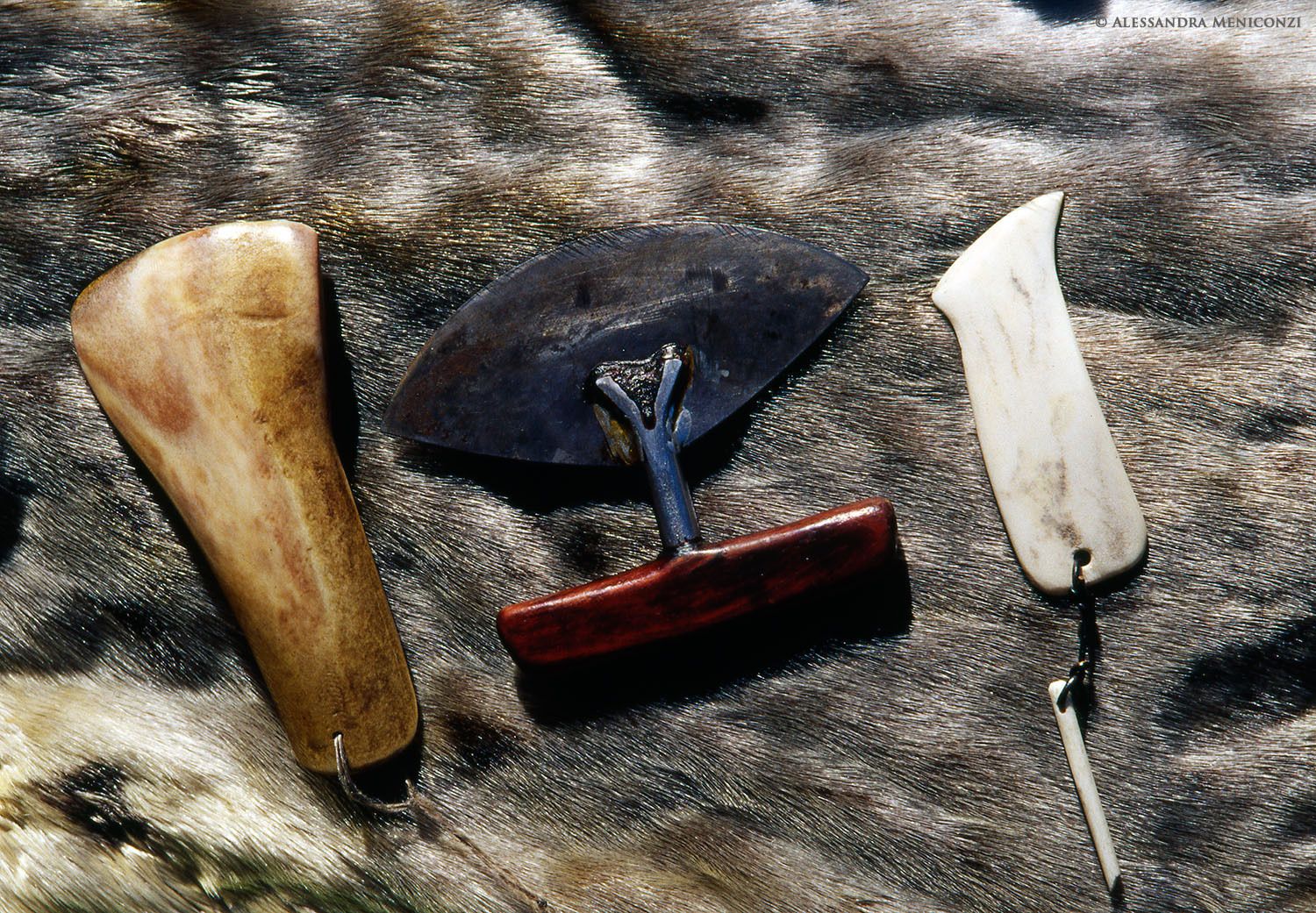 An ulu and other traditional Inuit tools for scraping animal hides and preparing leather and finished animal pelts, Northwest Greenland.