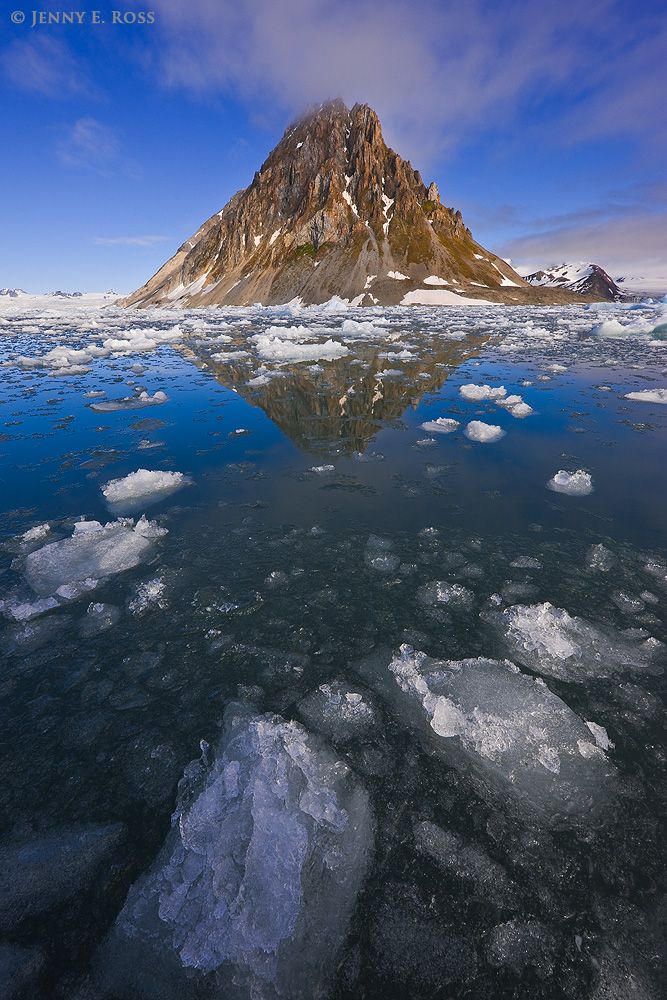 Mountains (the tip of Luciakammen) and melting ice in Burgerbukta, Hornsund.