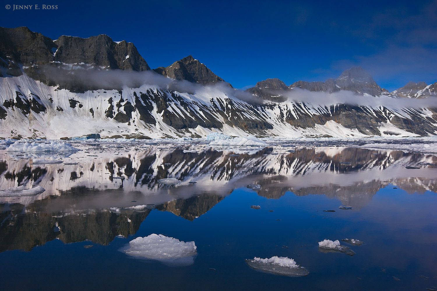 Mountains (Sofiekammen) and melting ice in Burgerbukta, Hornsund, Spitsbergen, Svalbard Archipelago, Norway.