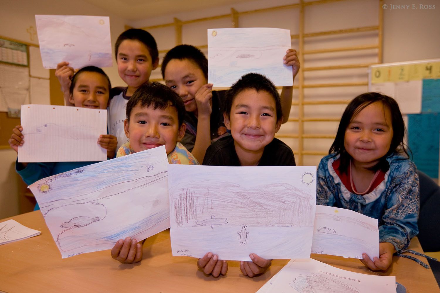 Children displaying their drawings of marine mammals in the Siorapaluk elementary school, Northwest Greenland.