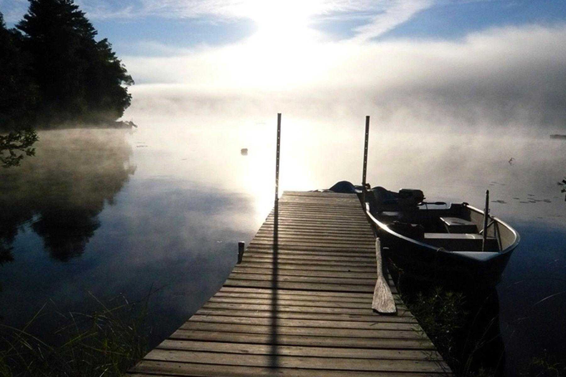 Canada - dock and boat at sunrise.