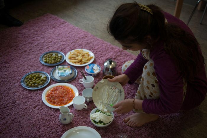 Sarah prepares breakfast in her room in an apartment in a German town where she moved after being released from Islamic State (IS) captivity in Iraq.