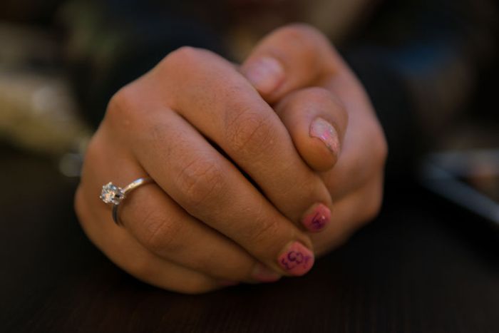 The hands of Sarah. She is going to school in a German town where she moved after being released from Islamic State (IS) captivity in Iraq. There are a number of apartments in the German state of Baden Wurttemberg where women and children, who have escaped IS captivity are sheltered. She says "My dream is to become a police officer or an engineer." 23_0_907_1story_of_isis_victim_sarah_noriko_hayashi__24.jpg