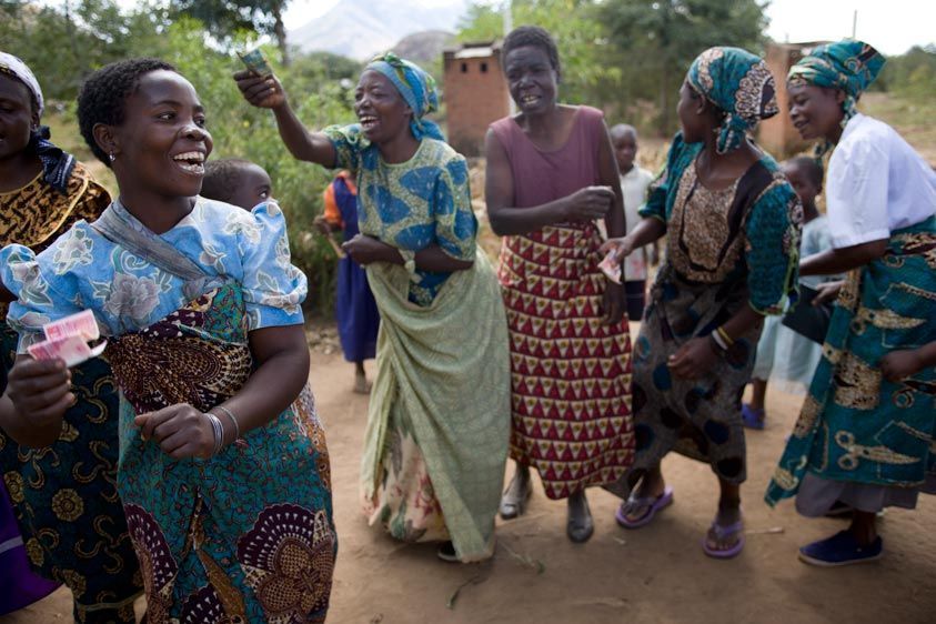 The Namirazi group in Kaundama village ritualizes collecting funds for their VSL program with song and dance. Celebrate VSL